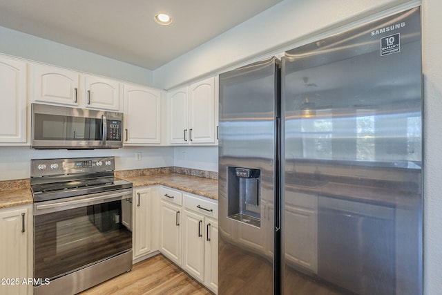 1886 E Don Carlos Ave Unit 136, Tempe, AZ 85281 - kitchen featuring appliances with stainless steel finishes, light wood-style flooring, white cabinetry, and recessed lighting