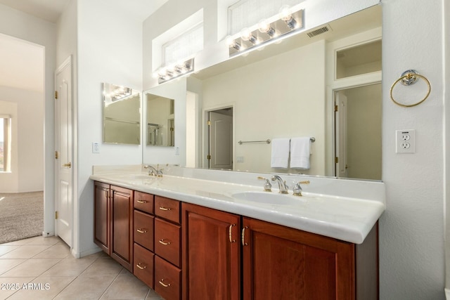 bathroom featuring tile patterned floors and vanity