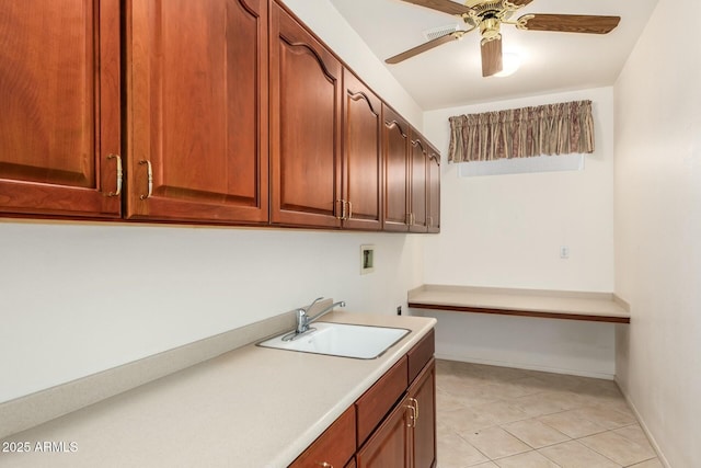 clothes washing area featuring washer hookup, sink, cabinets, and ceiling fan