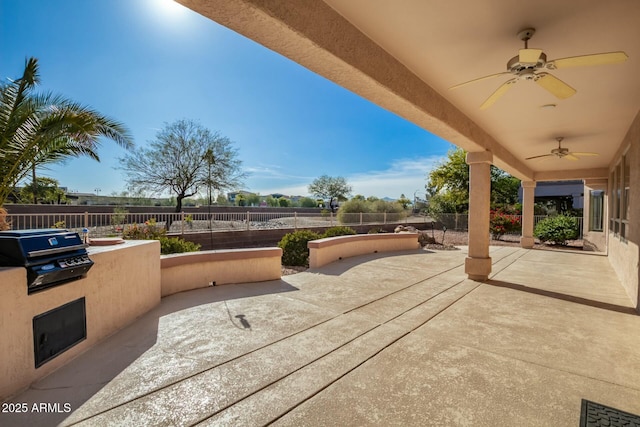 view of patio featuring ceiling fan, grilling area, and area for grilling