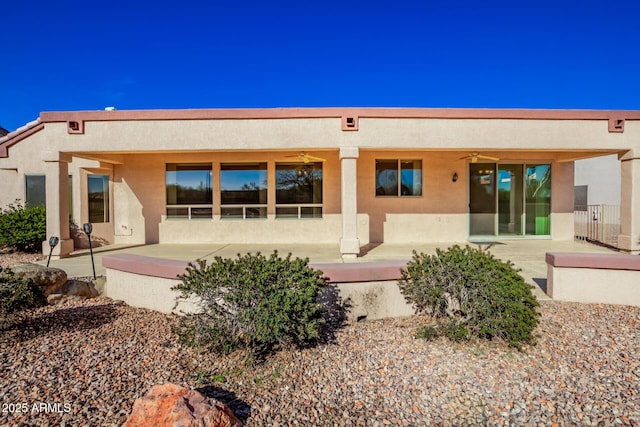 back of property with a patio area and ceiling fan