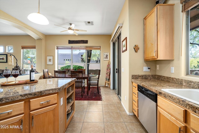 kitchen featuring stainless steel dishwasher, ceiling fan, and plenty of natural light