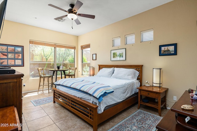 bedroom with baseboards, visible vents, and light tile patterned floors