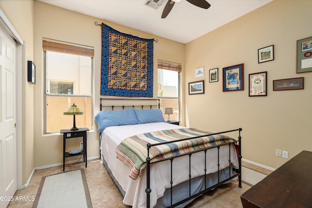 bedroom with visible vents, ceiling fan, a closet, and baseboards