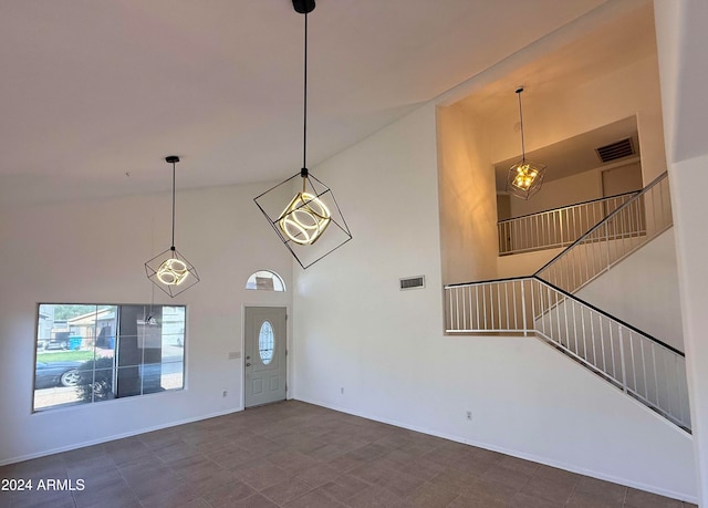 foyer featuring a towering ceiling