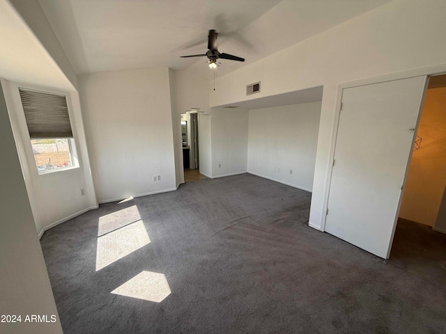 interior space with ceiling fan and vaulted ceiling