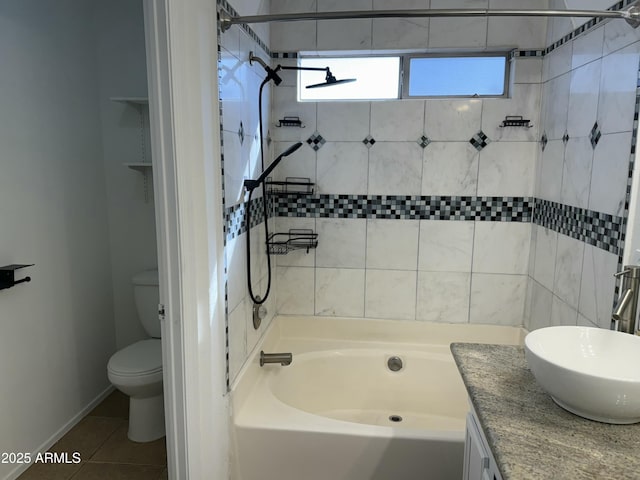 full bathroom featuring vanity, tiled shower / bath combo, tile patterned floors, and toilet