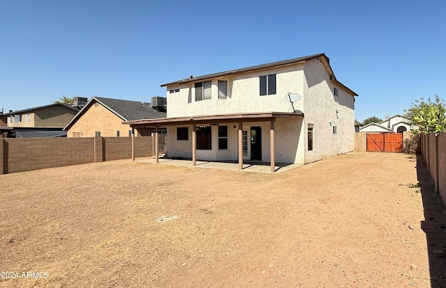 rear view of house featuring central AC and a patio