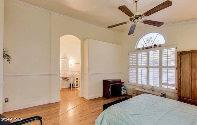 bedroom with light hardwood / wood-style floors, ceiling fan, and crown molding