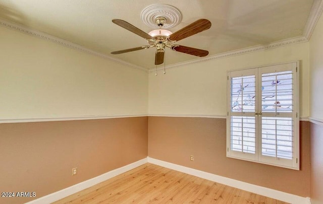 empty room with light hardwood / wood-style floors, ceiling fan, and ornamental molding