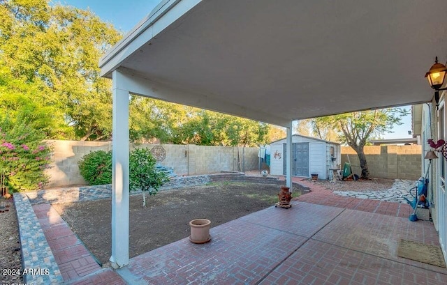 view of patio with a storage shed