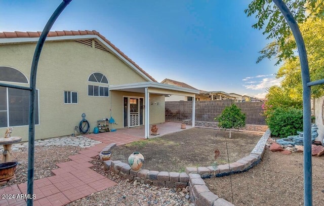 rear view of house featuring a patio