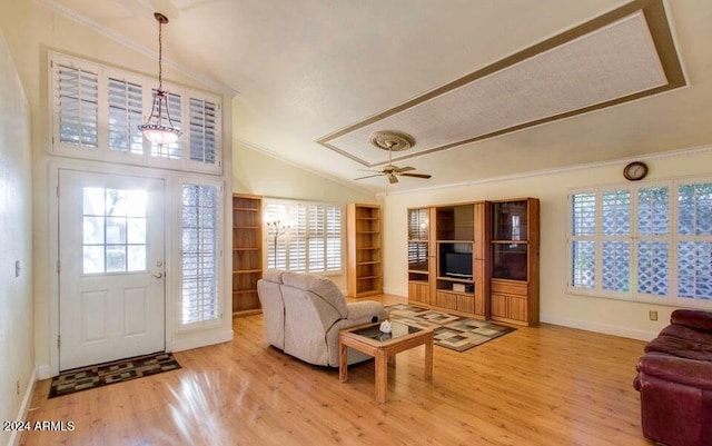 living room with light hardwood / wood-style floors, vaulted ceiling, ceiling fan, and crown molding