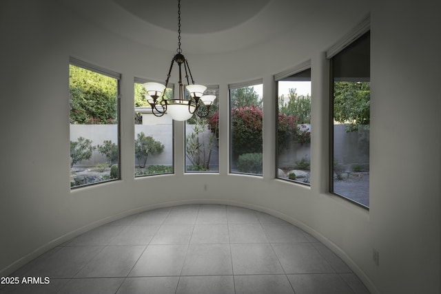 unfurnished sunroom with an inviting chandelier and a wealth of natural light