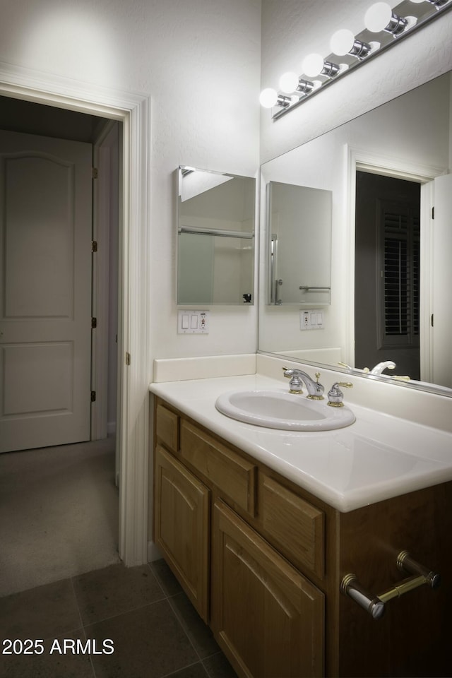 bathroom featuring tile patterned floors and vanity