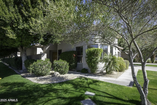 view of home's exterior featuring a yard