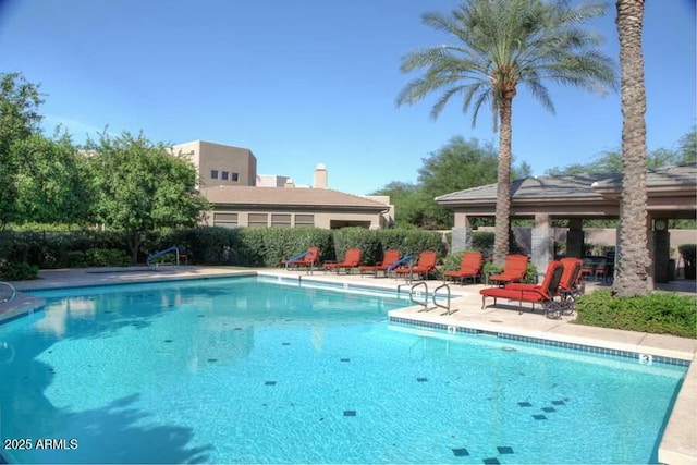 view of swimming pool featuring a gazebo