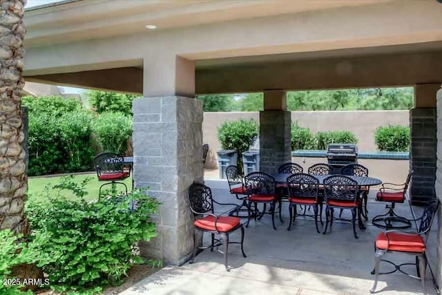 view of patio with a grill