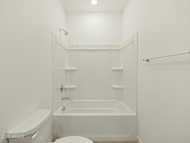 bathroom with bathing tub / shower combination and toilet