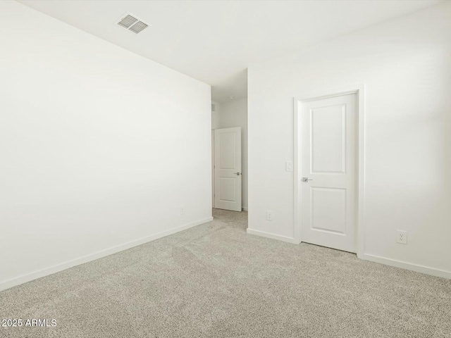 unfurnished bedroom with visible vents, baseboards, and light colored carpet