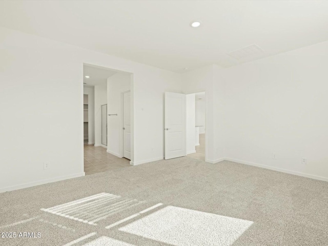 empty room with recessed lighting, baseboards, and carpet floors