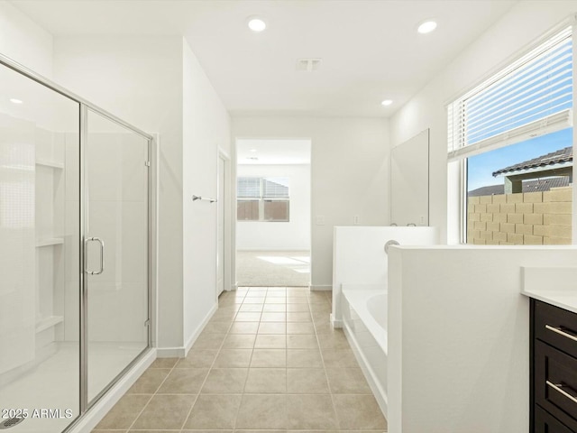 bathroom with vanity, recessed lighting, tile patterned flooring, a shower stall, and a garden tub