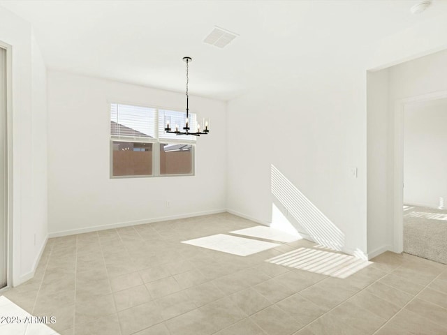 unfurnished dining area with light tile patterned floors, visible vents, baseboards, and a chandelier