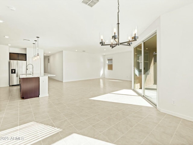 interior space with recessed lighting, visible vents, an inviting chandelier, and light tile patterned flooring