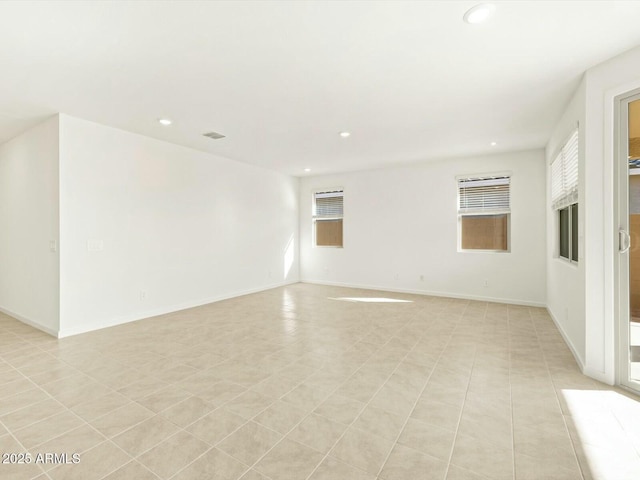 unfurnished room featuring recessed lighting, visible vents, baseboards, and light tile patterned floors