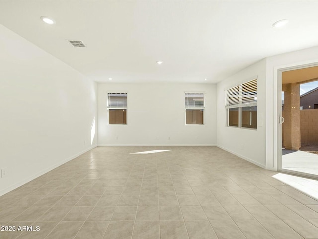 empty room featuring recessed lighting, visible vents, baseboards, and light tile patterned floors