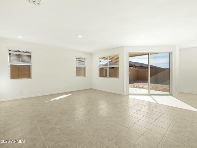 unfurnished room featuring recessed lighting, baseboards, visible vents, and light tile patterned flooring