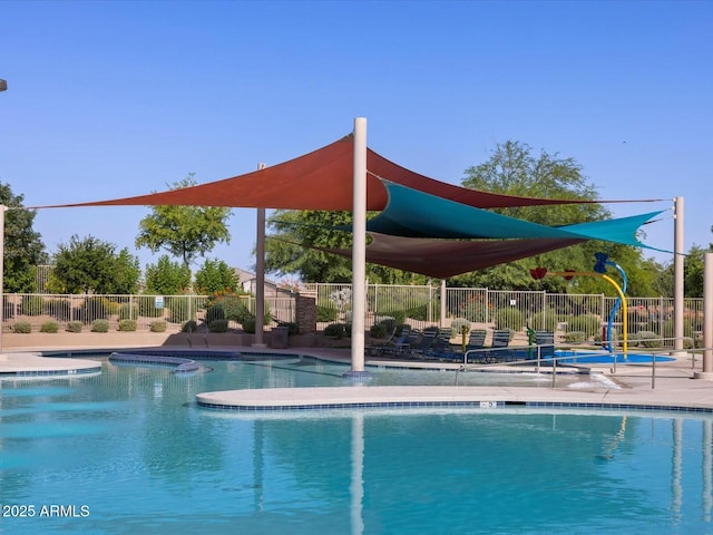 community pool with playground community and fence