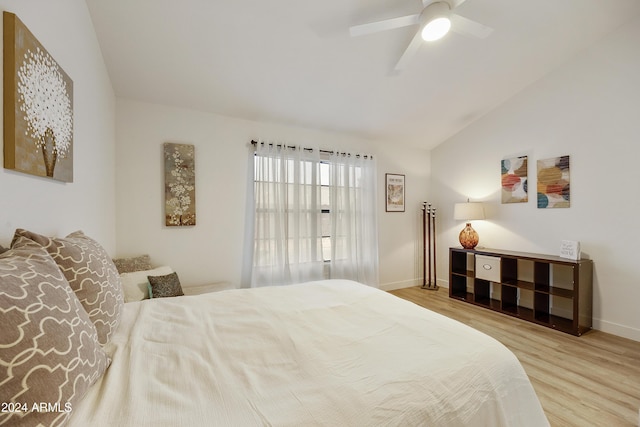 4901 E Kelton Ln Unit 1006, Scottsdale, AZ 85254 - bedroom featuring wood finished floors, lofted ceiling, and a ceiling fan