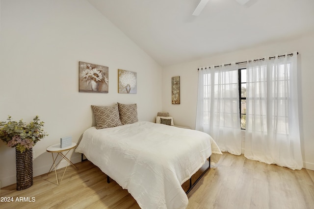 4901 E Kelton Ln Unit 1006, Scottsdale, AZ 85254 - bedroom featuring light wood-style floors, vaulted ceiling, and ceiling fan