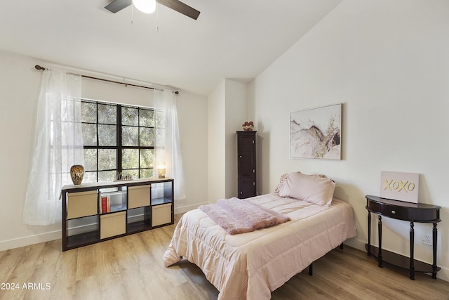 4901 E Kelton Ln Unit 1006, Scottsdale, AZ 85254 - bedroom with light wood-style flooring, lofted ceiling, and ceiling fan