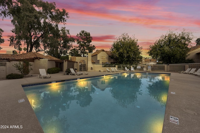 4901 E Kelton Ln Unit 1006, Scottsdale, AZ 85254 - pool at dusk with a patio area and a community pool