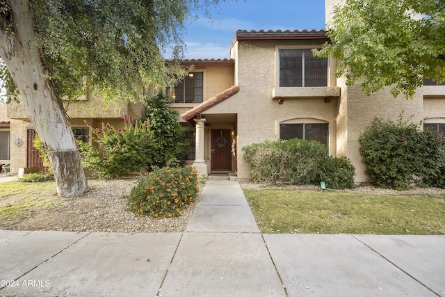 4901 E Kelton Ln Unit 1006, Scottsdale, AZ 85254 - view of front of house with stucco siding and a tiled roof