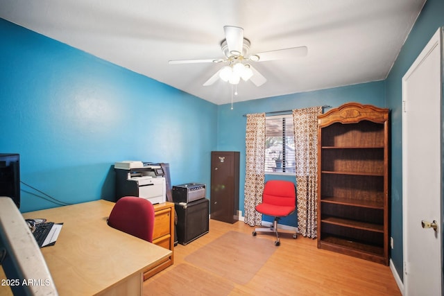 office space with light wood-type flooring and ceiling fan