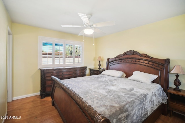 bedroom featuring wood-type flooring and ceiling fan