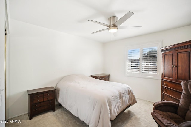 bedroom featuring ceiling fan and light colored carpet