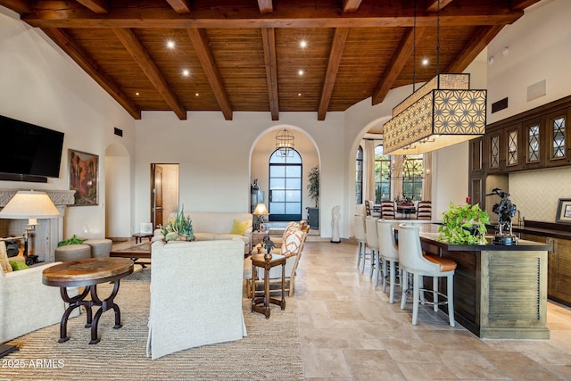 27256 N 97th Pl, Scottsdale, AZ 85262 - living room featuring a high ceiling, wooden ceiling, and beam ceiling