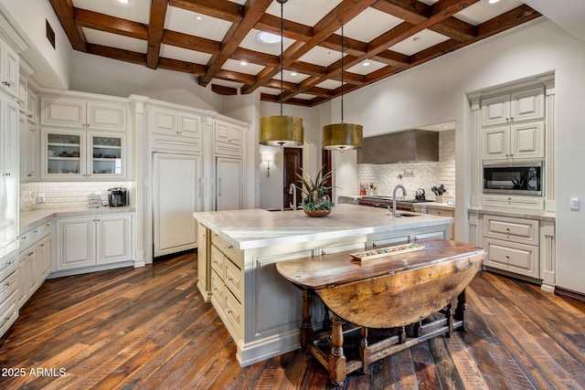 27256 N 97th Pl, Scottsdale, AZ 85262 - kitchen with coffered ceiling, decorative light fixtures, black microwave, an island with sink, and decorative backsplash
