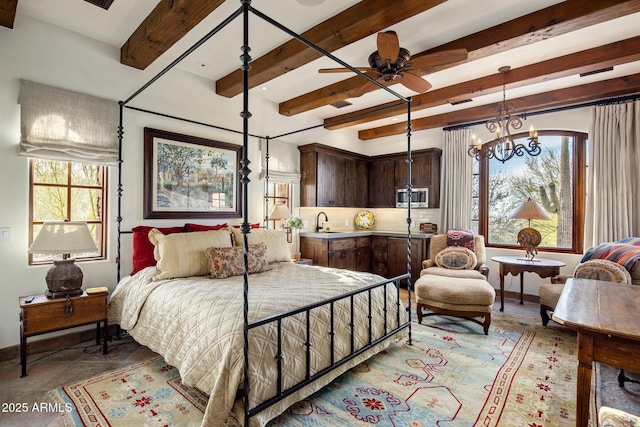 27256 N 97th Pl, Scottsdale, AZ 85262 - bedroom featuring beamed ceiling, ceiling fan with notable chandelier, and sink