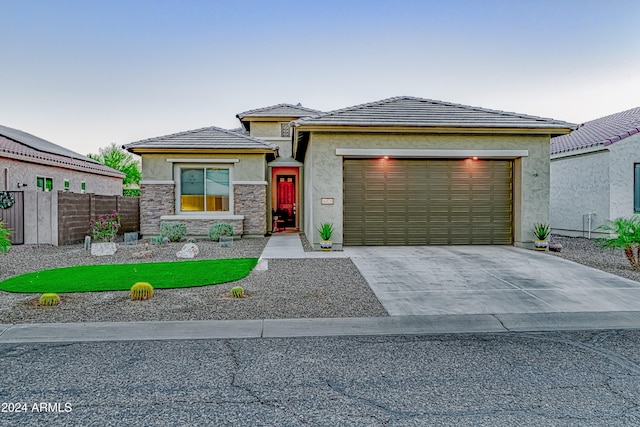 prairie-style house featuring a garage