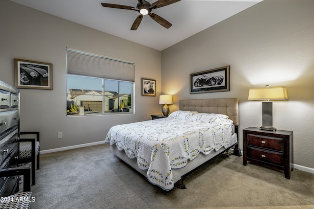 bedroom featuring ceiling fan and carpet