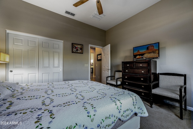 carpeted bedroom with a closet and ceiling fan