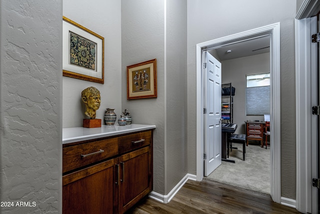 corridor featuring dark hardwood / wood-style floors