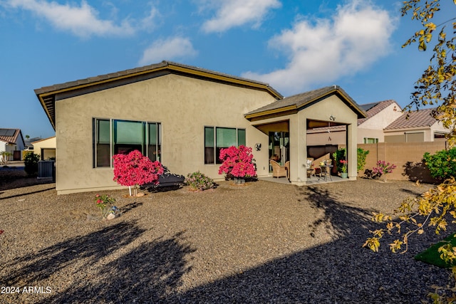 back of property featuring a patio