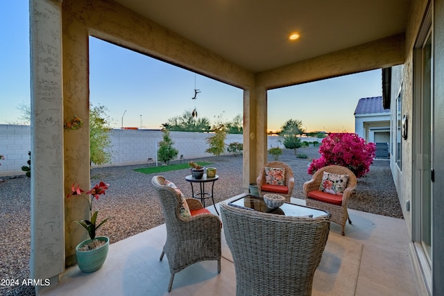 view of patio terrace at dusk