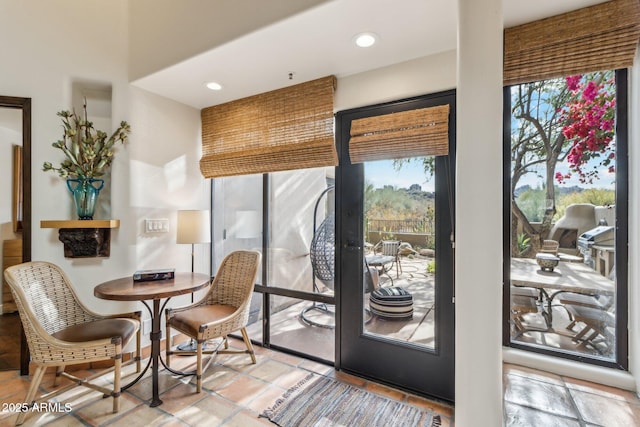 doorway to outside featuring light tile patterned flooring